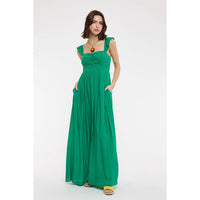Woman wearing a green dress on a white background