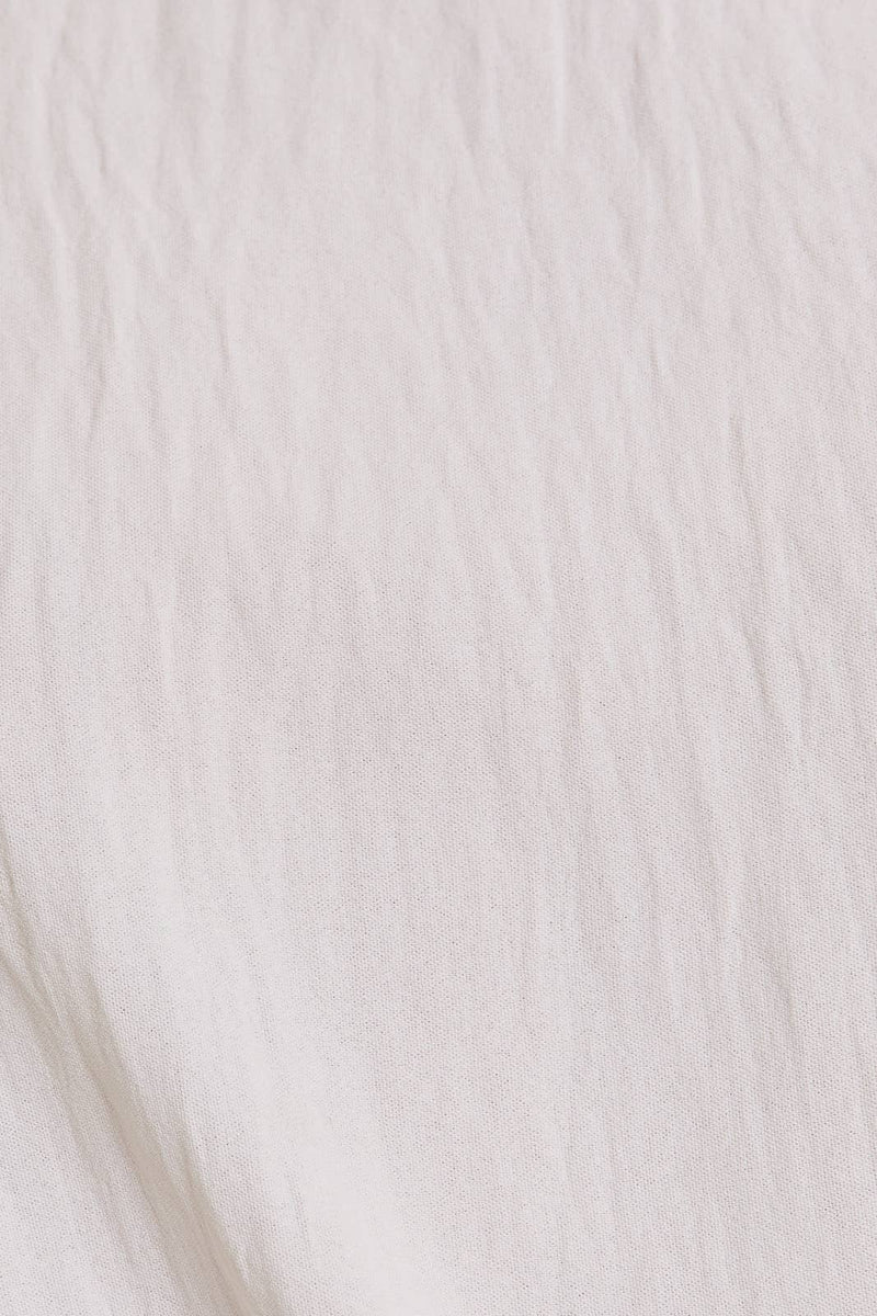 SOLID WOVEN TEE WITH FRONT KNOT DETAIL