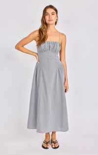 Woman wearing a gray dress on a white background