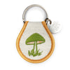 Keychain with embroidered green mushroom design on a white background